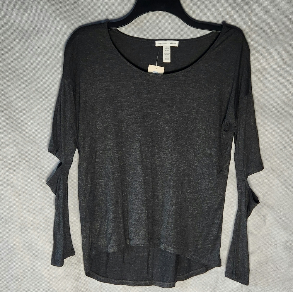 The Ambiance Apparel High Low T-Shirt Features A Chic Round Neckline